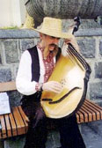 Man in National Costume Playing Bandura